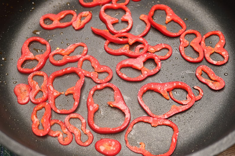 Peppers strips when frying in the pan.