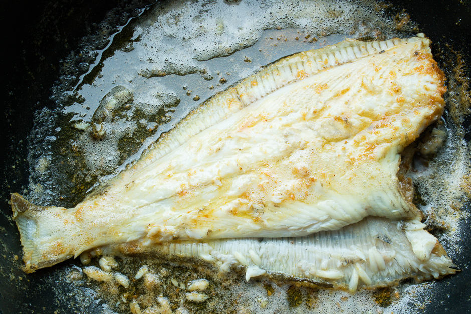 Plaice fried in a pan without skin