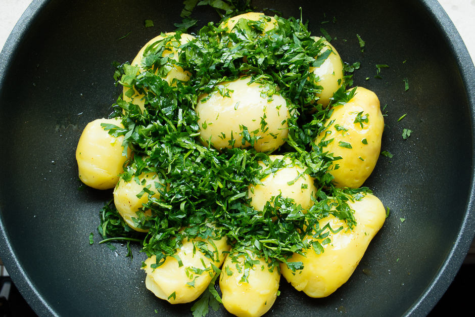 Potatoes in a pan with parsley.