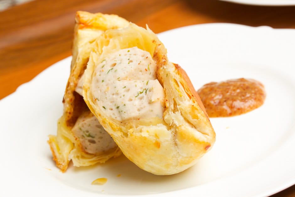 Popular snack and finger food for children's birthday parties: sausages in puff pastry known as sausages in a dressing gown.