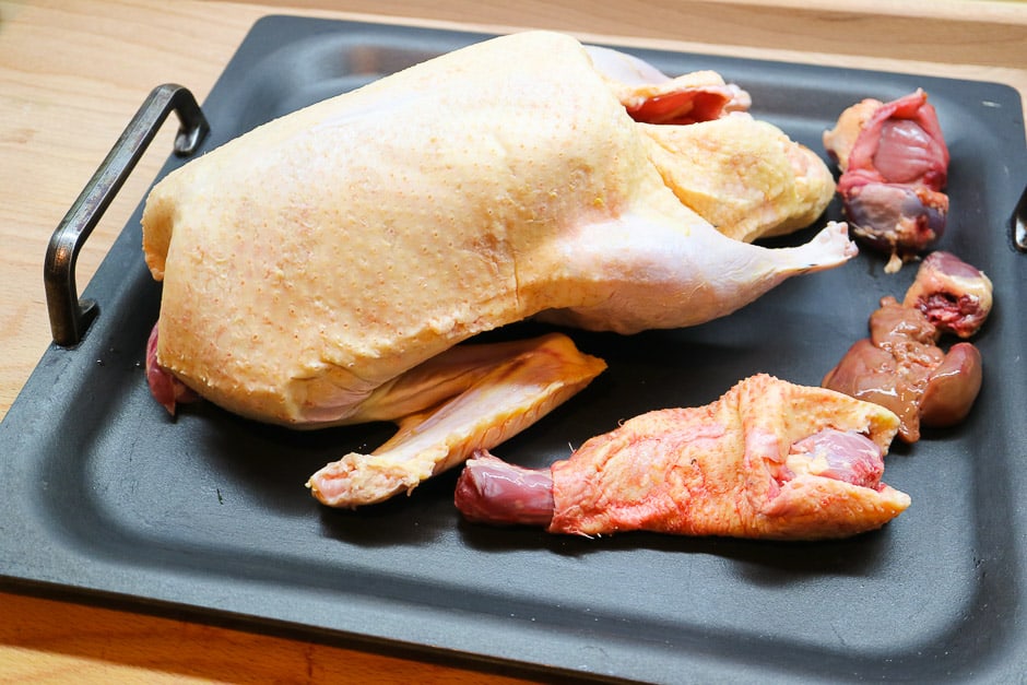 duck with entrails on baking sheet