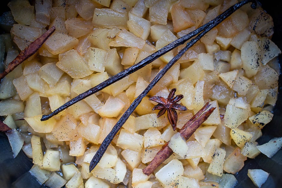 Apple compote cooked in a pot with vanilla pod, clove, anise and cinnamon