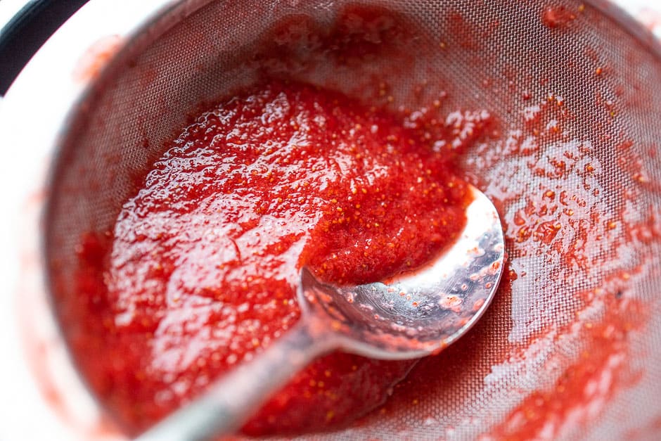 Strain the strawberry sauce through a sieve