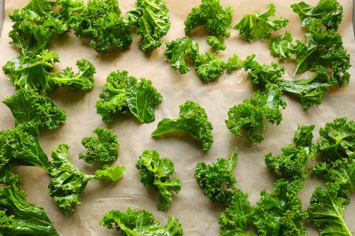 Spread the kale leaves on the baking sheet