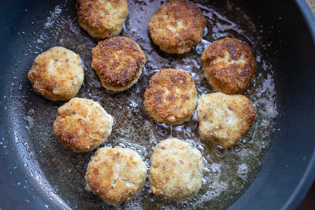 Fry fish cakes in a pan