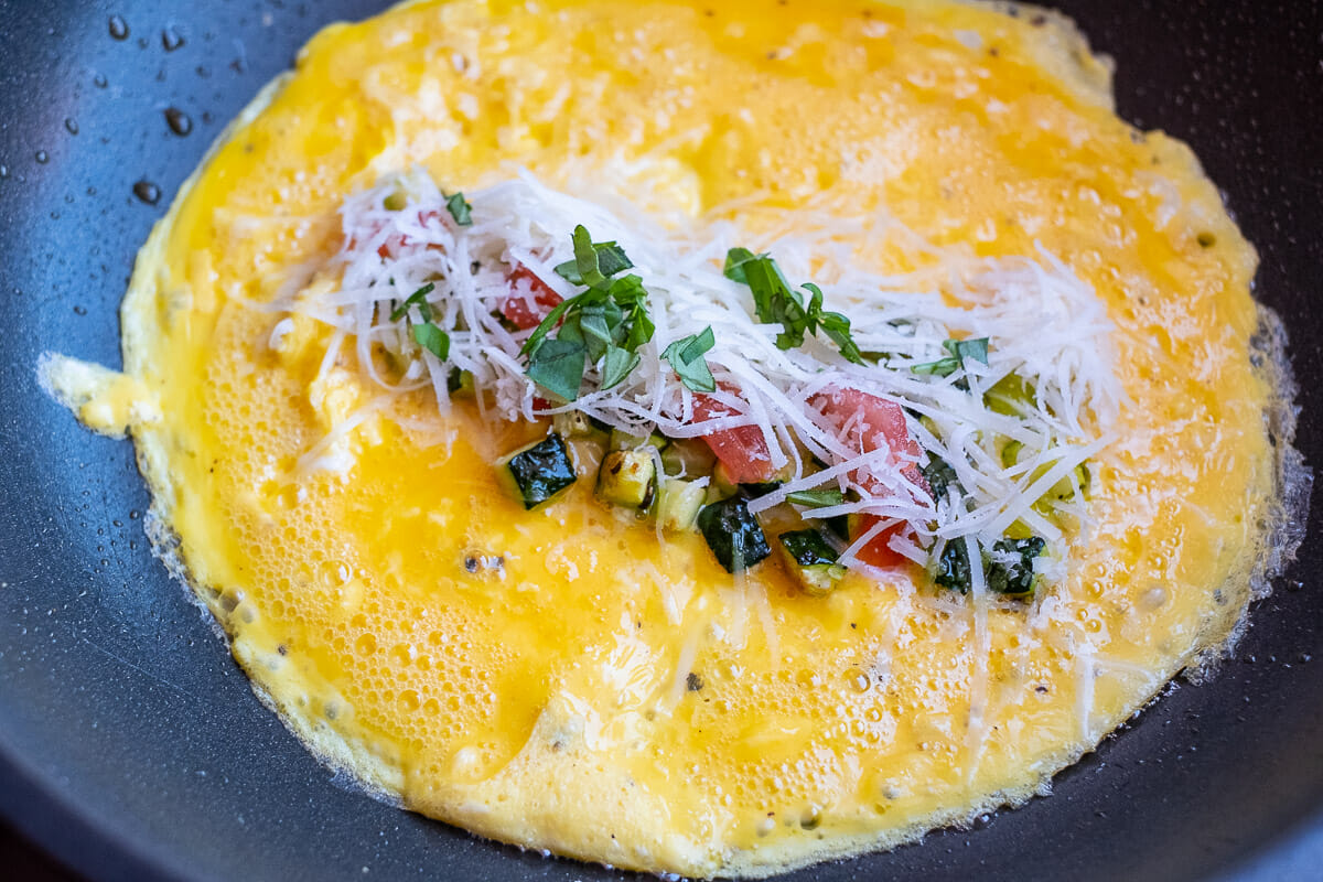 Omelette when filling in the pan