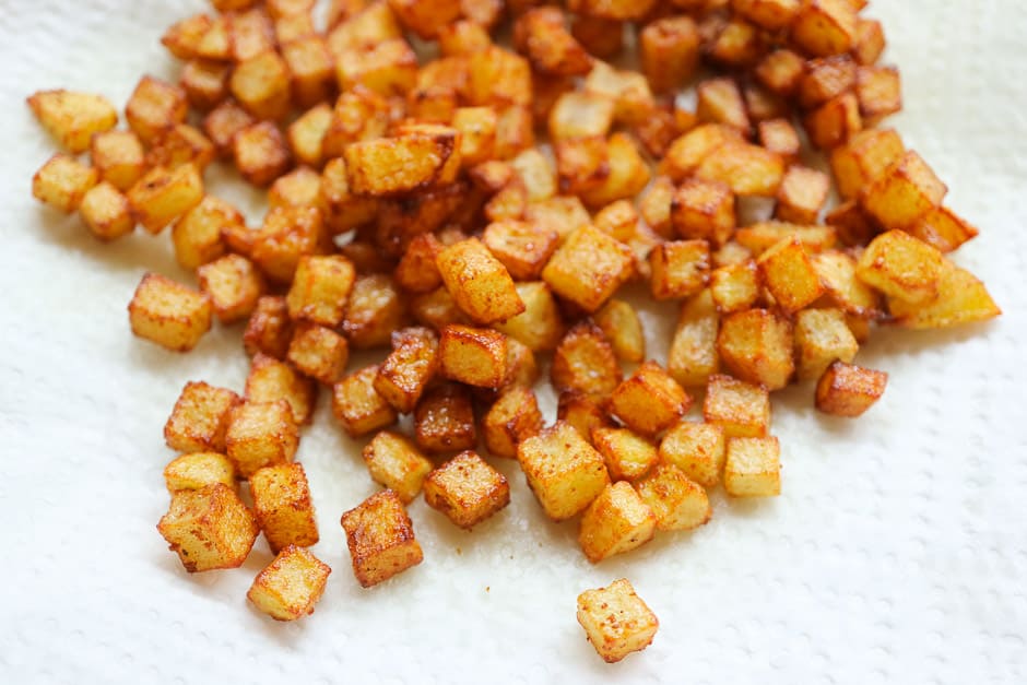 Potato cubes fried close-up