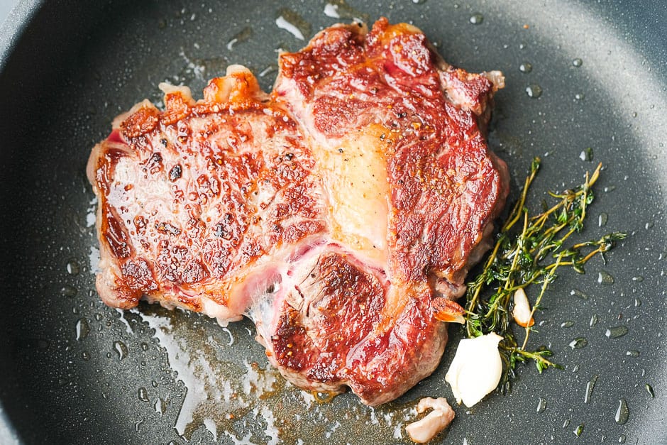 Turn steak over while searing.