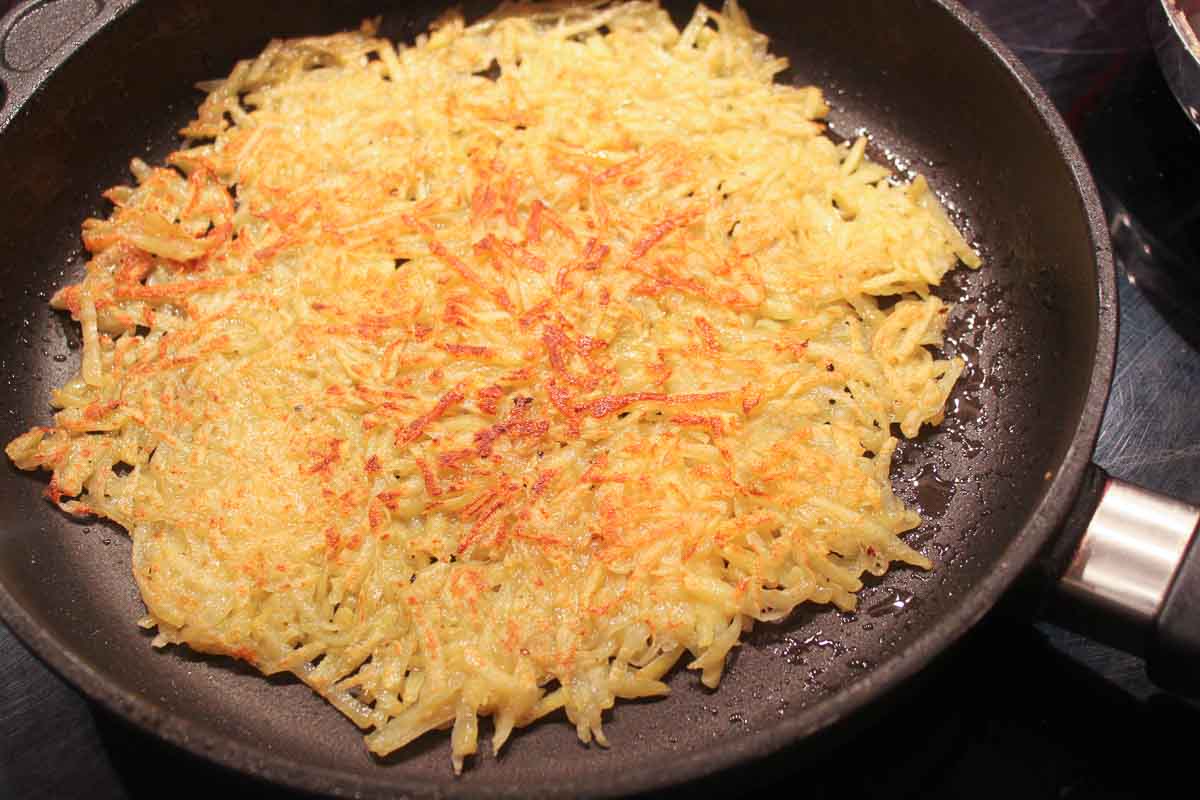 Potato rösti fried crispy in a pan