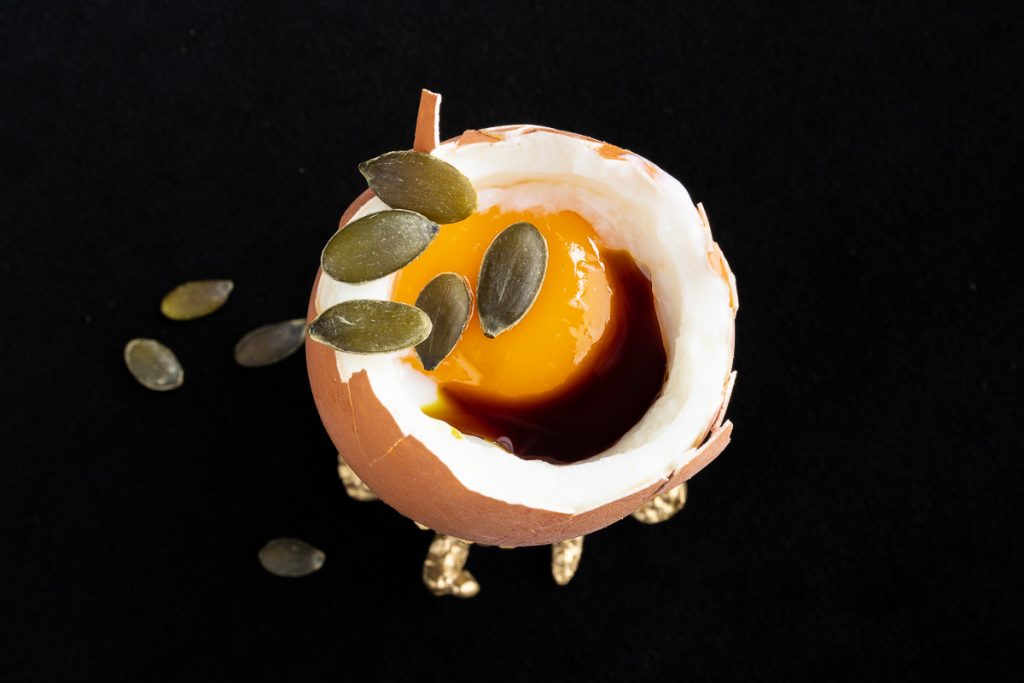 Soft boiled egg with pumpkin seeds