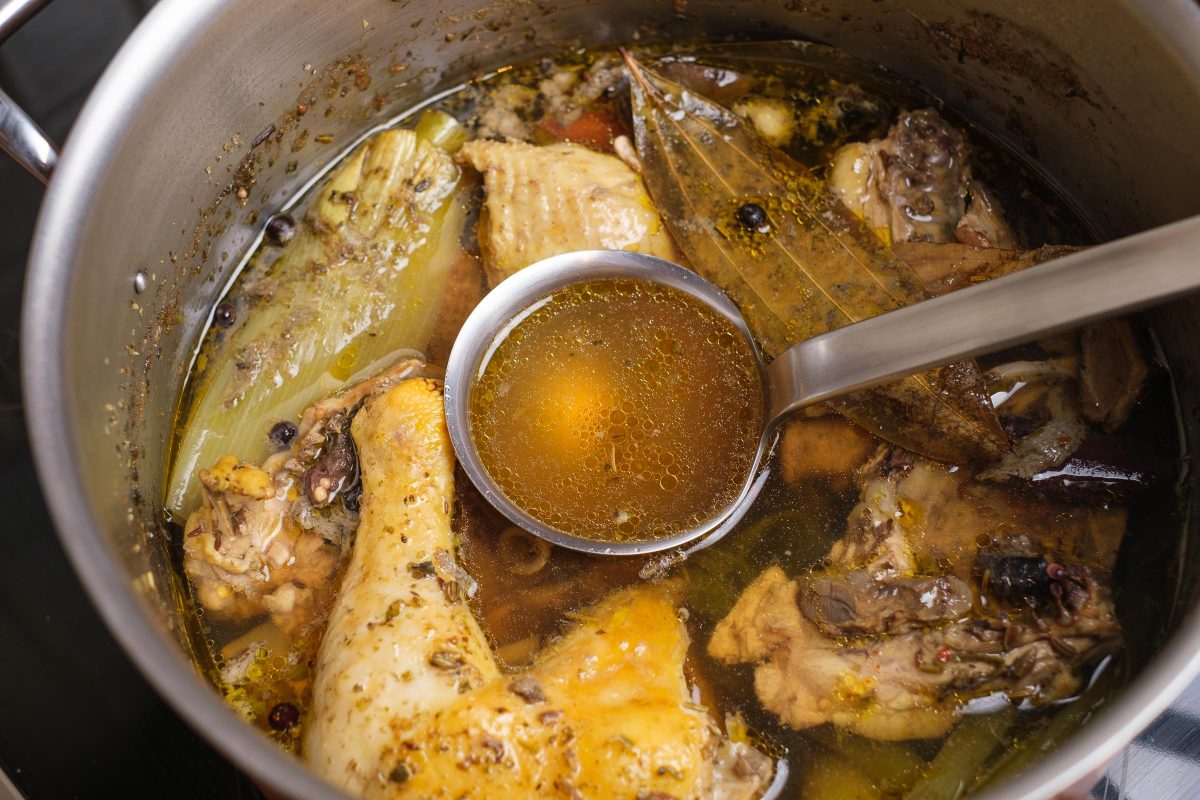 Boiled chicken soup in the pot