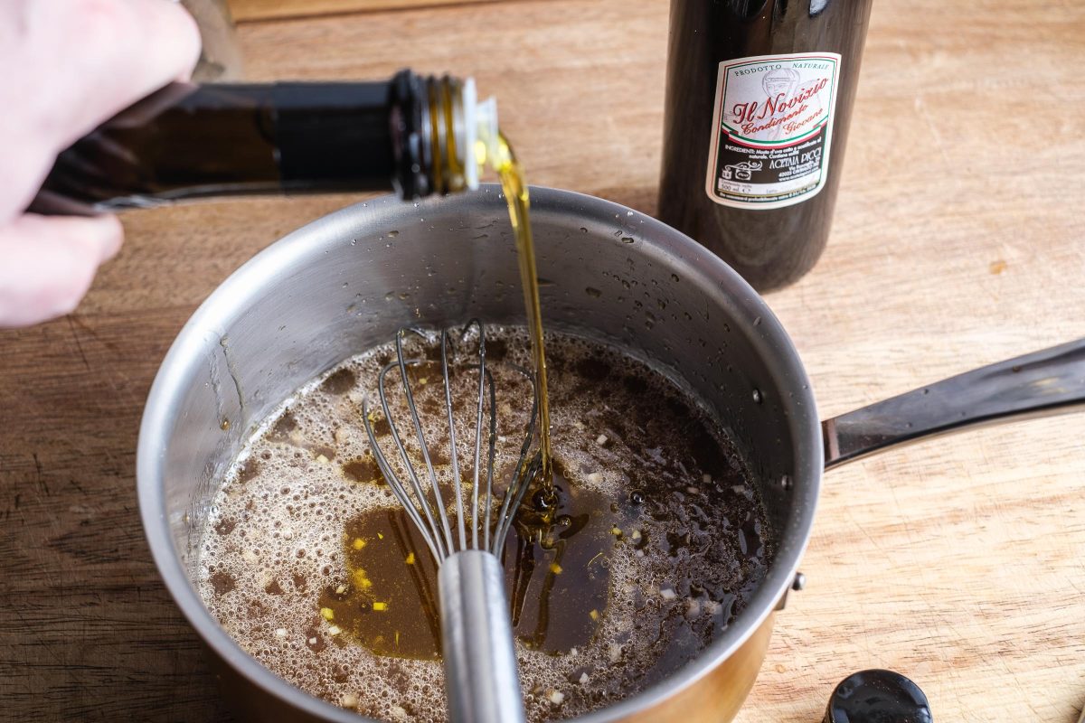 Add oil to the balsamic dressing