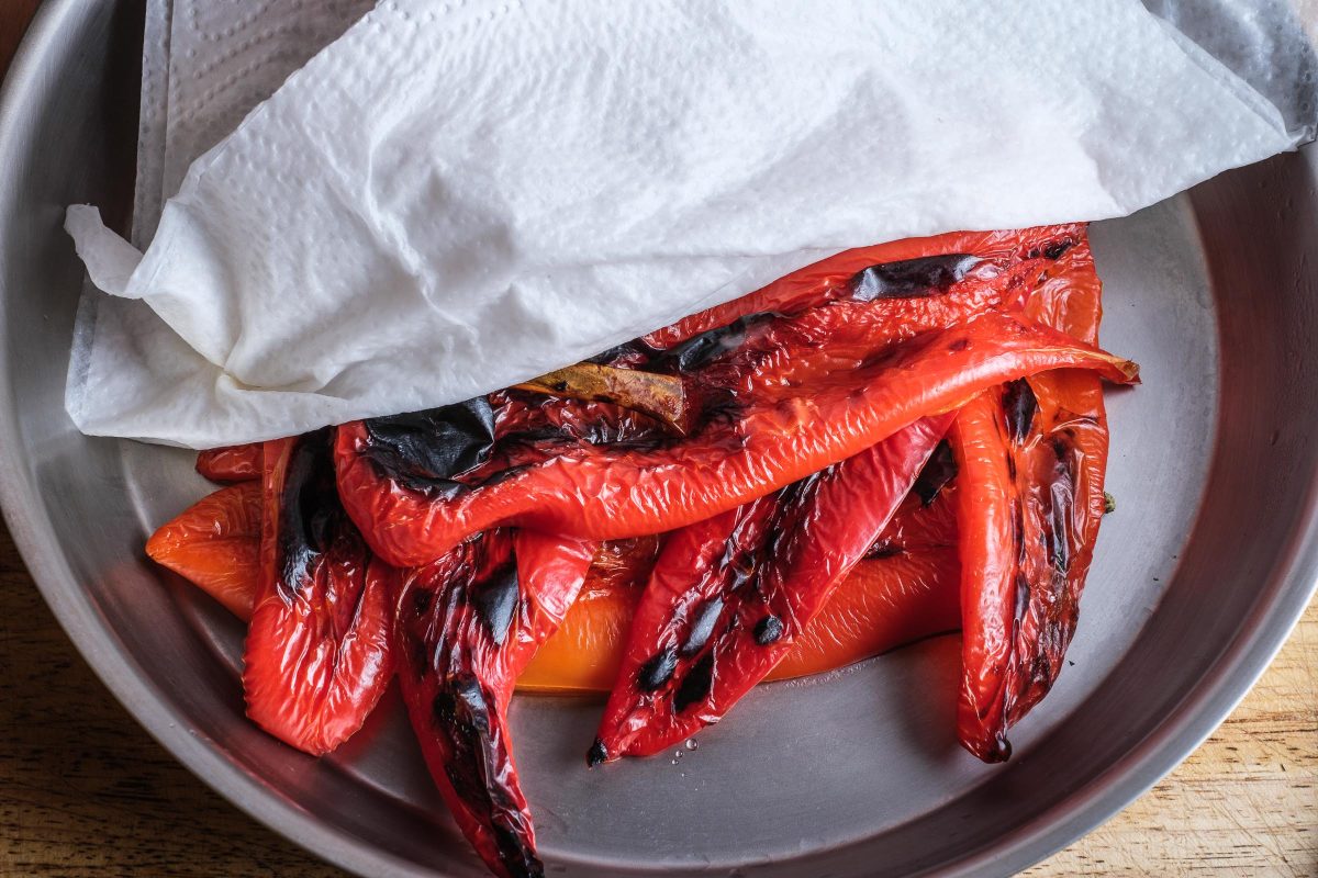 Cover grilled peppers with damp cloth