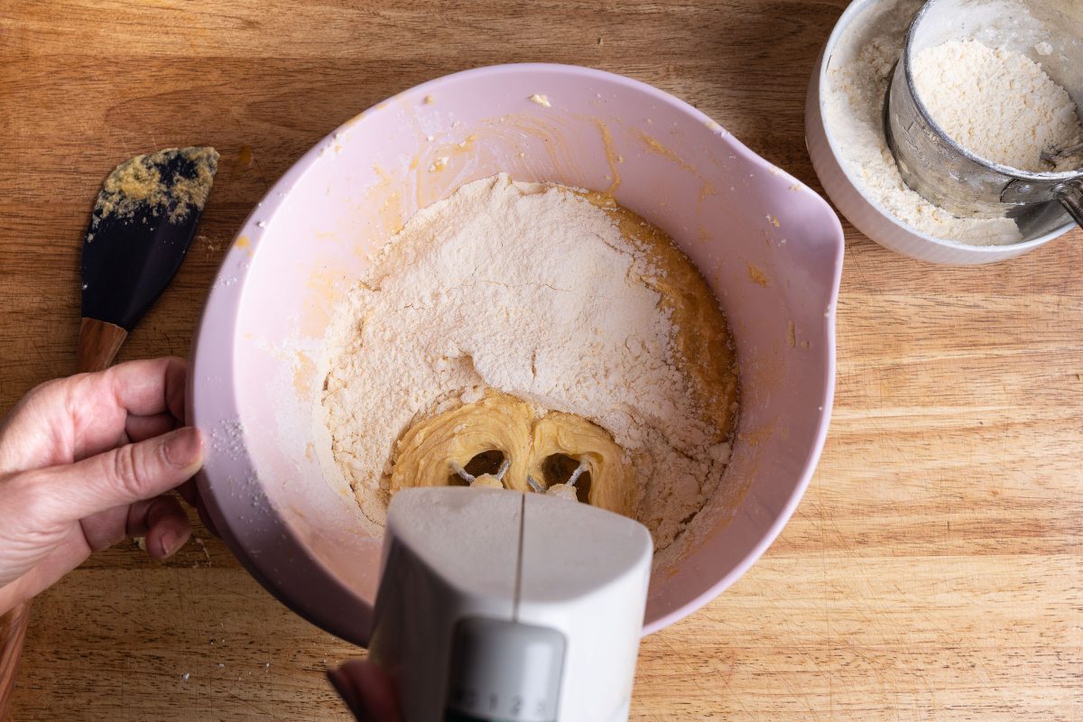Stir cake batter, flour while stirring