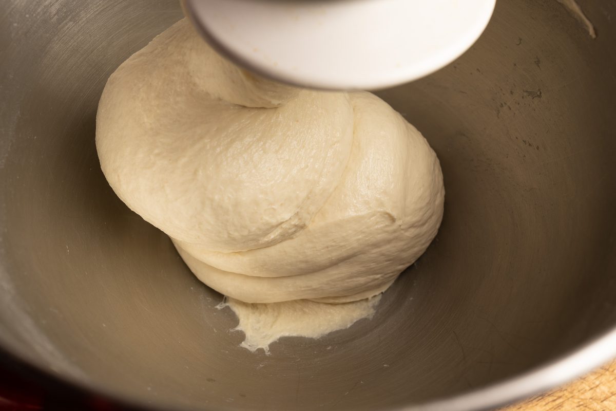 Knead pizza dough with yeast