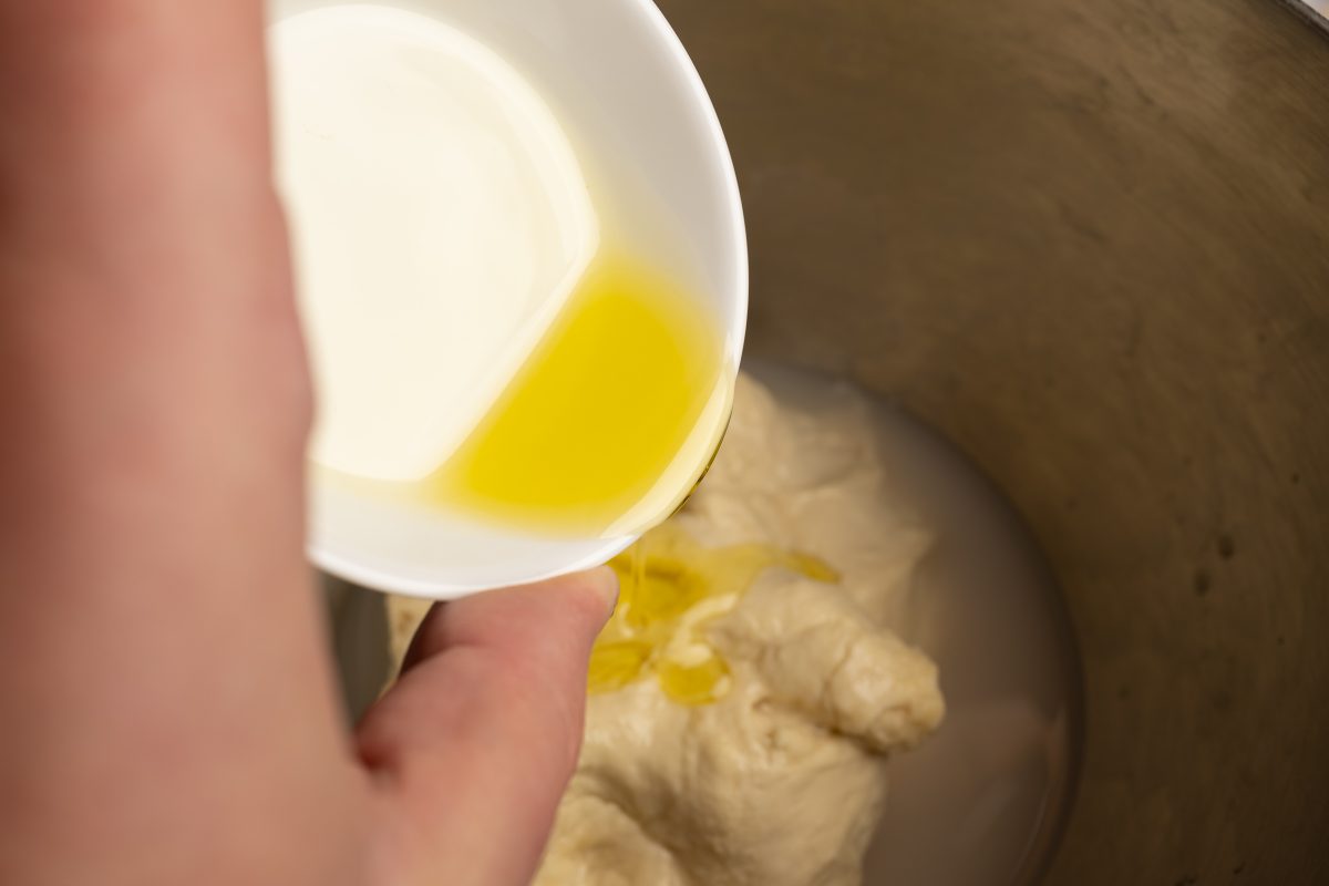 Add olive oil to the flour water dough