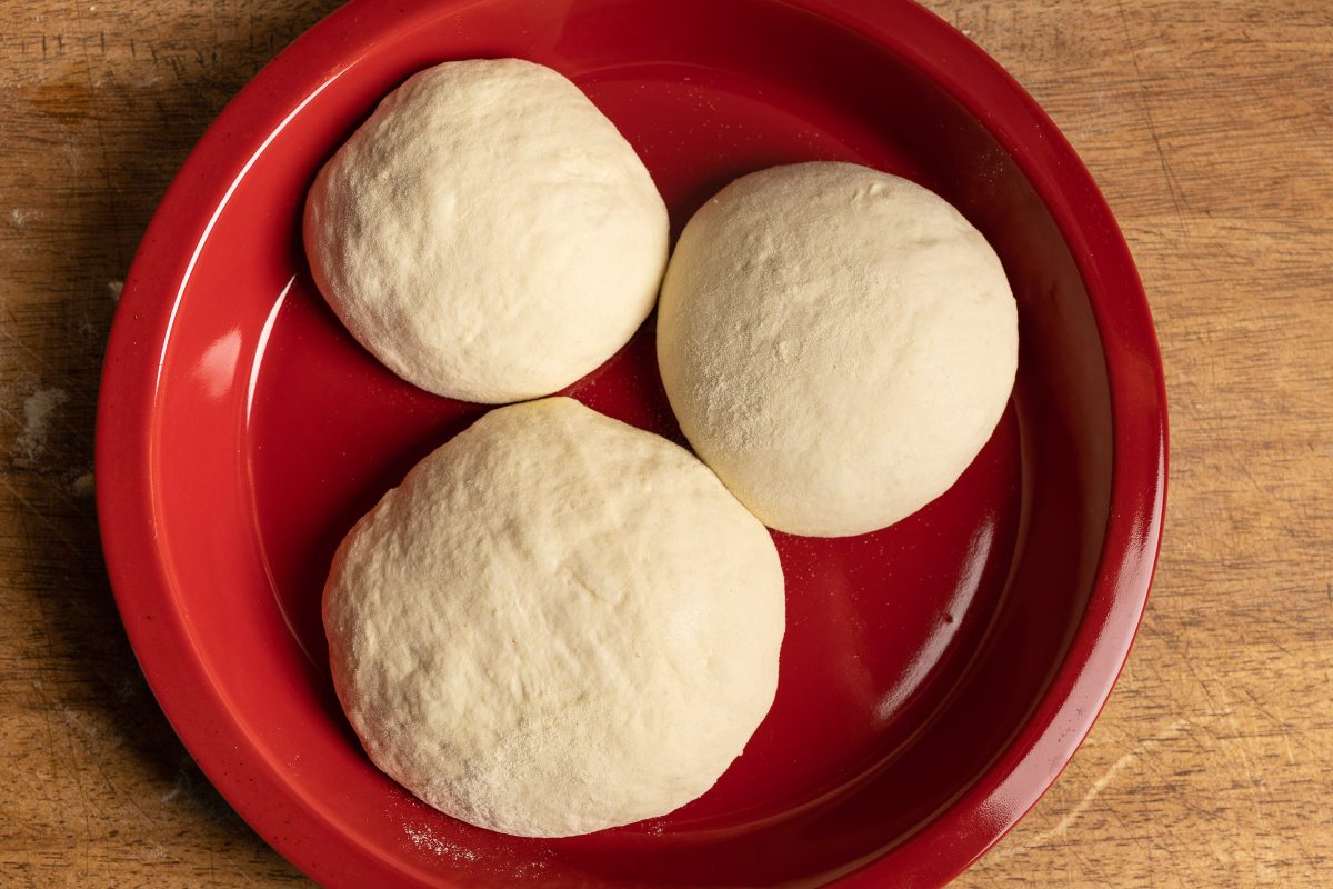 Pizza dough balls on plate