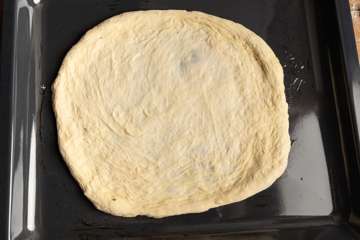 Pizza dough shaped baking sheet
