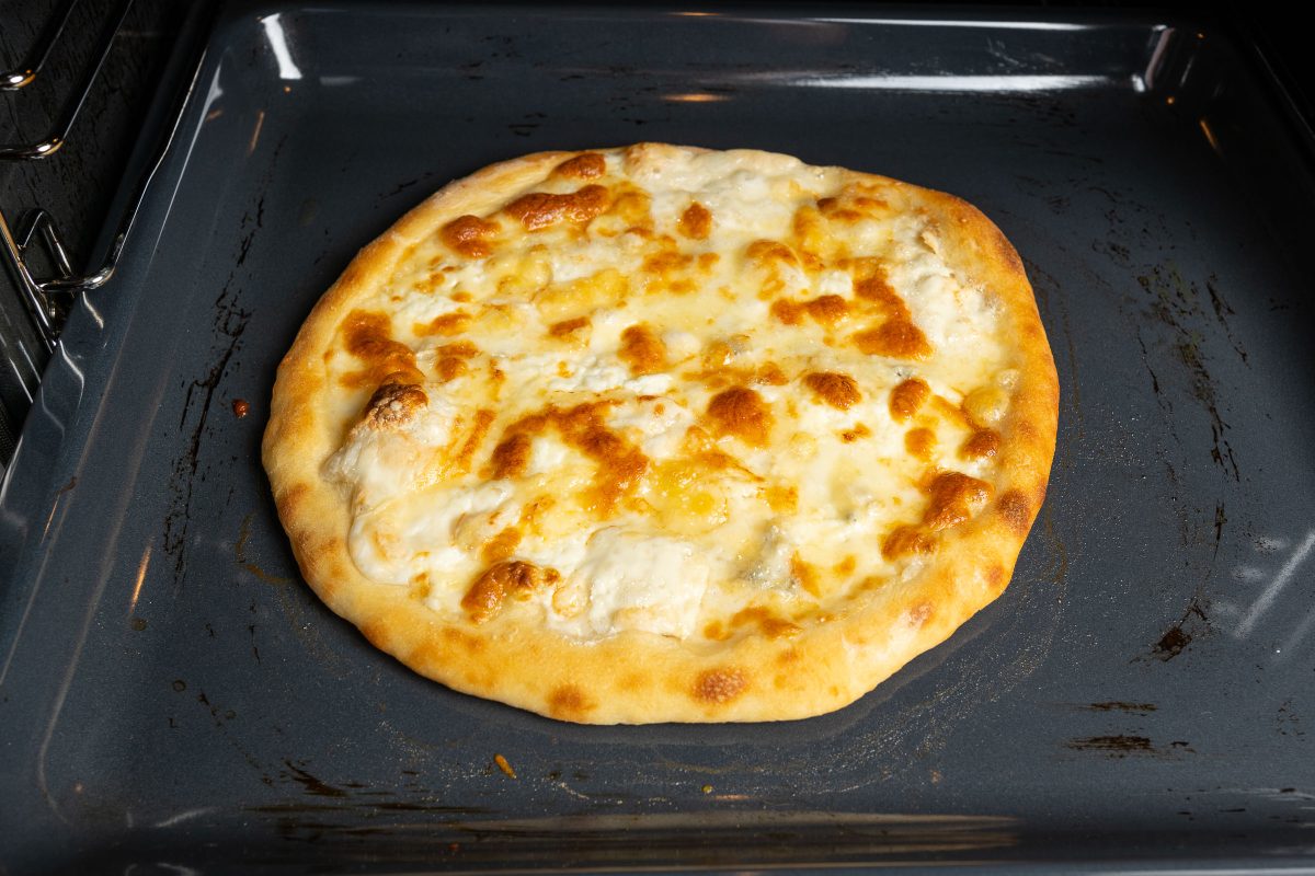Pizza Quattro Formaggi - Four Cheese Pizza - Baked in the oven on the griddle.