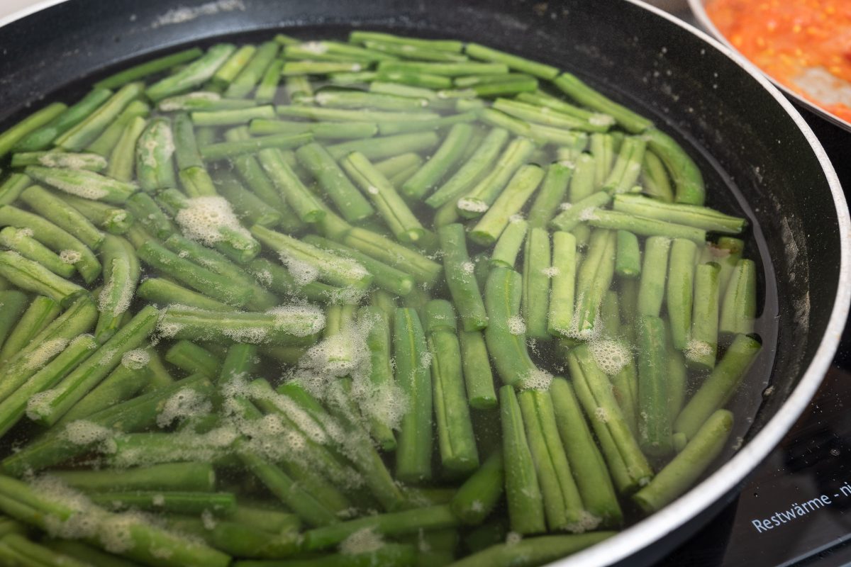 Boil green beans in salted water