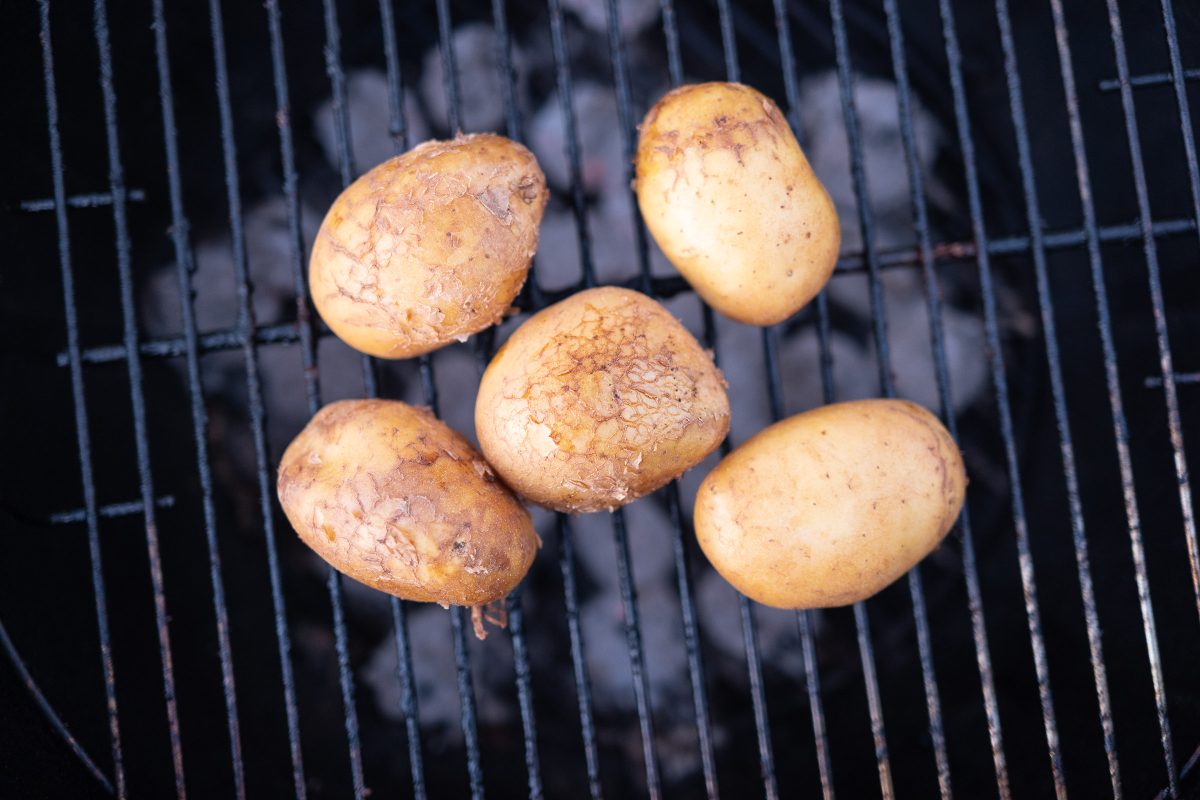Potatoes on the grill grate