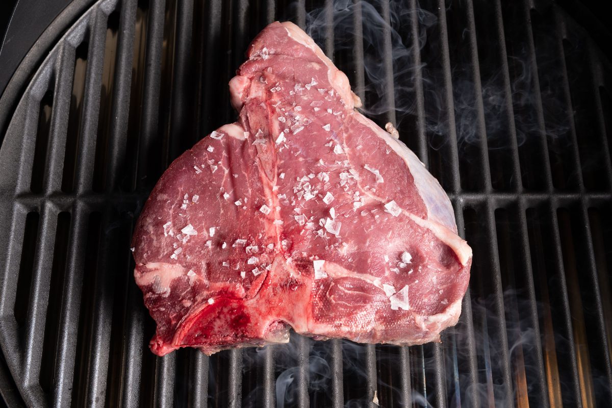 Porterhouse steak photographed from above on the grill