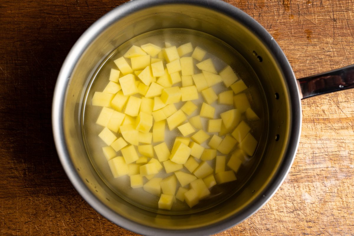 Boil potato cubes in salted water